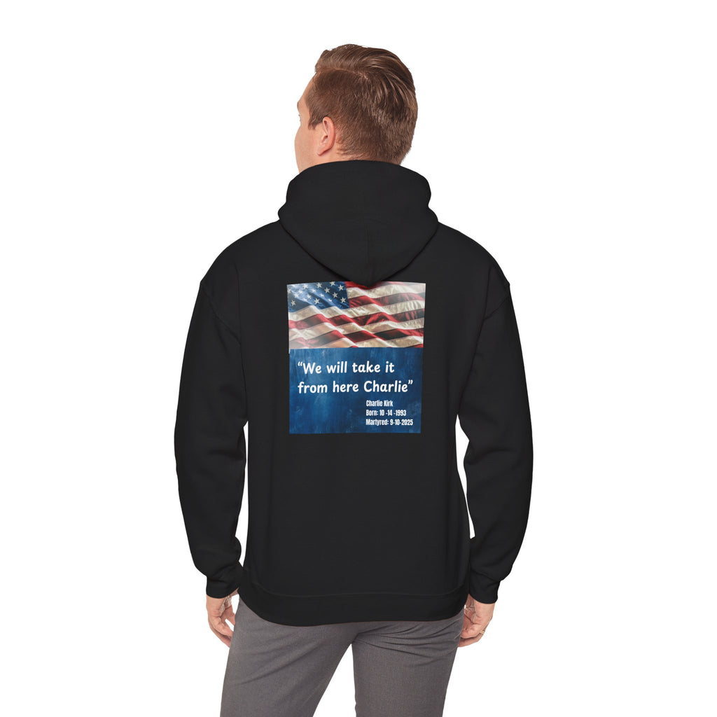 Person wearing a black hoodie with an American flag and text on the back, on a white background