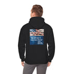 Person wearing a black hoodie with an American flag and text on the back, on a white background